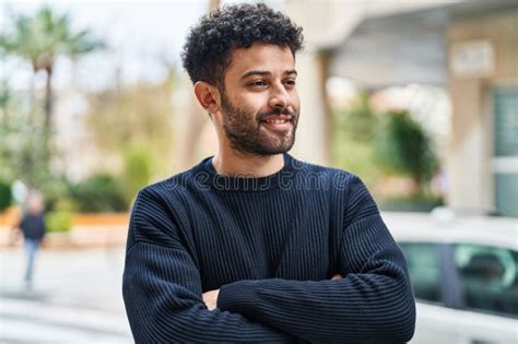 Young Arab Man Smiling Confident Standing With Arms Crossed Gesture At