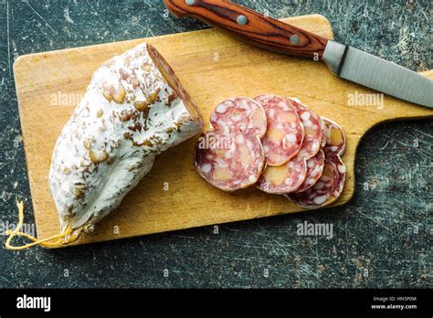 Tasty Sliced Salami With White Mold On Cutting Board Top View Stock