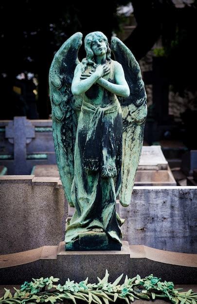 Premium Photo | Old angel statue in cemetery