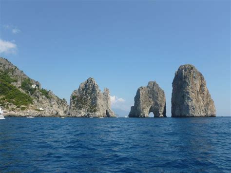 Three Large Rocks Sticking Out Of The Water