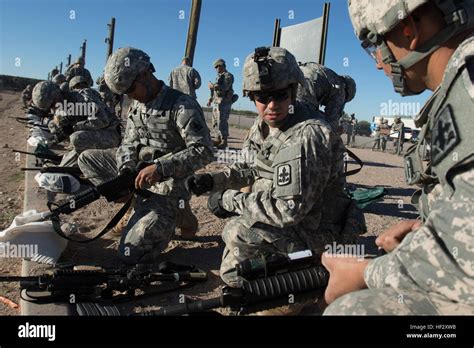 Arizona Army National Guard Soldiers Make Adjustments To Their Rifle