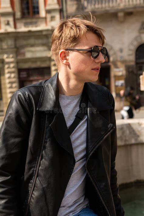 Portrait of a Guy in Round Sunglasses and Leather Jacket Stock Photo ...