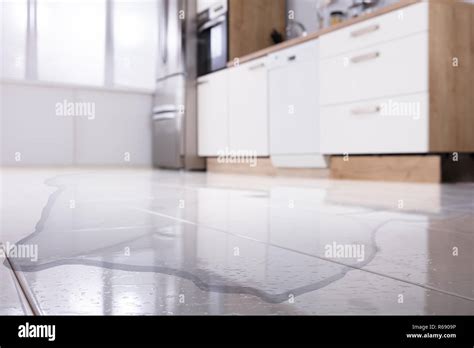 Spilled Water On Kitchen Floor Stock Photo Alamy