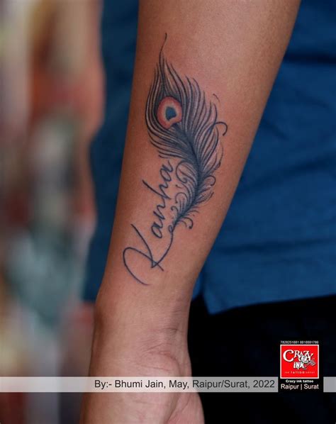 Name with Peacock feather tattoo design | Feather tattoo, Feather ...