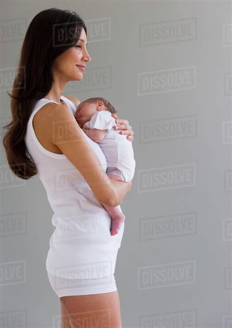 Woman Holding Her Newborn Baby Stock Photo Dissolve