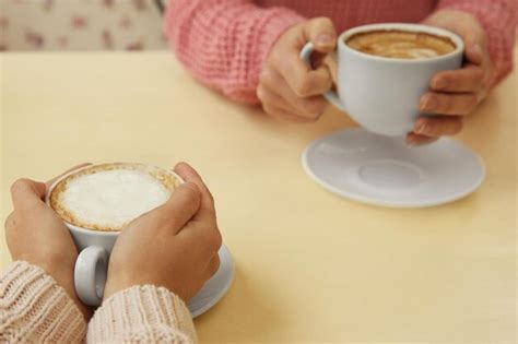 Premium Photo Female Hands Holding Cups Of Coffee Closeup