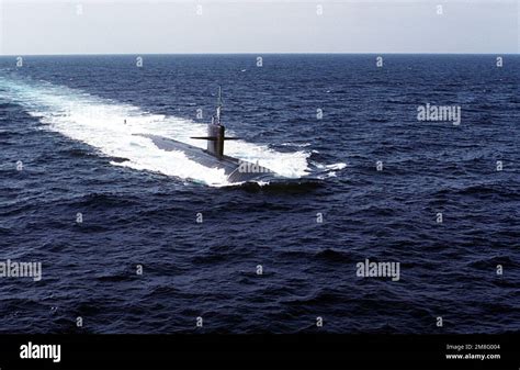 A starboard bow view of the nuclear-powered attack submarine USS ...