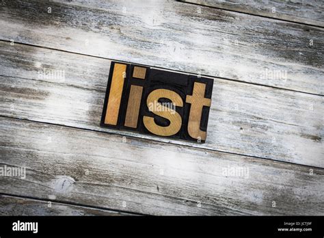 The Word List Written In Wooden Letterpress Type On A White Washed