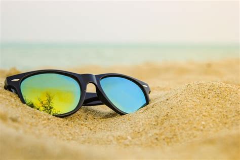 Premium Photo Close Up Of Sunglasses On Beach