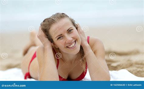 Woman In A Bikini Relaxes On A Sandy Beach At The Ocean Stock Photo Image Of Female Bikini