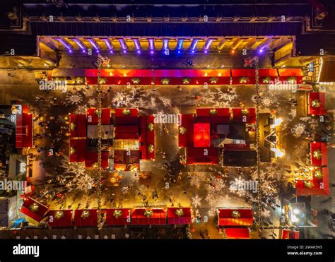 Night aerial view from drone of stalls in Edinburgh Christmas Market ...