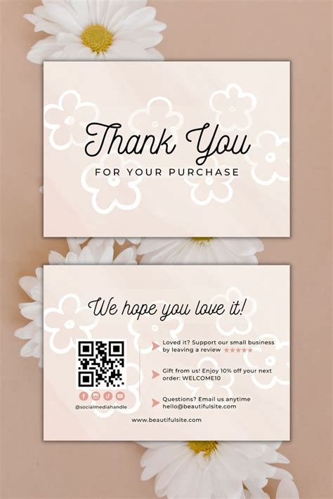 Two Business Cards With White Daisies In Front Of Them And The Words