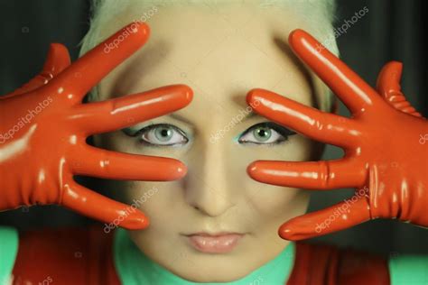 Cute Short Haired Blonde Girl Posing Latex Catsuit Rubber Red Stock
