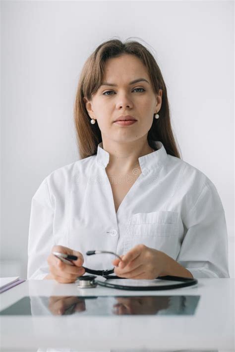 Young Caucasian Woman Doctor Wearing White Medical Coat And Stethoscope