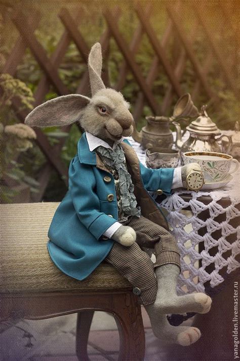 A Stuffed Rabbit Sitting On Top Of A Wooden Bench