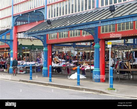 People Walking And Shopping At Stalls In Huddersfield Market In West