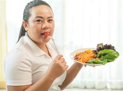 Fat woman eating salad stock image. Image of vegetarian - 38165781