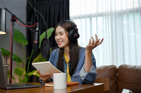 Cheerful Asian Female Radio Host Or Online Influencer Is Recording And