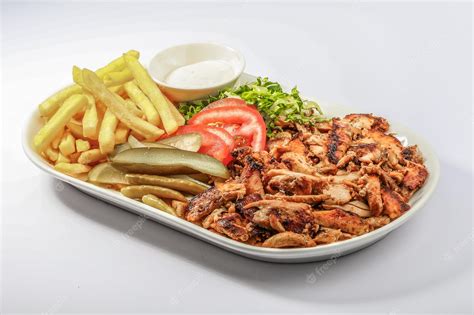 Premium Photo Chicken Shawarma Plate With Salad Fries Served In A