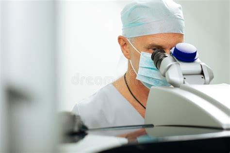 Experienced Mature Doctor Conducting the Vision Test Stock Photo - Image of male, optometrist ...