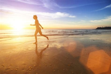 Running girl at sunset silhouette — Stock Photo © sdecoret #52812125