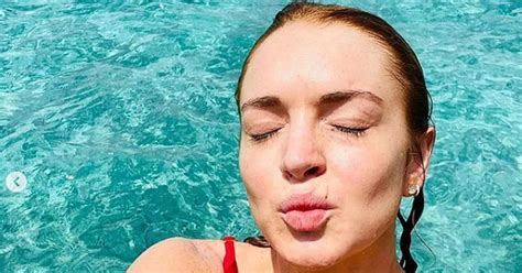 Lindsay Lohan 34 Channels Her Inner Baywatch Babe In Plunging Red
