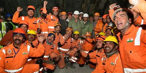 Trapped tunnel workers in India finally see the light of day