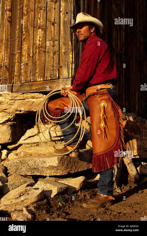 Cowboy Wearing Chaps By A Ranch Barn In Wyoming Stock Photo 2758233