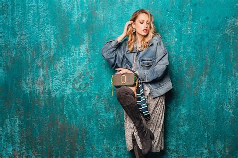 Free Photo Sexy Attractive Stylish Blonde Woman In Jeans And Oversize Jacket Walking Against