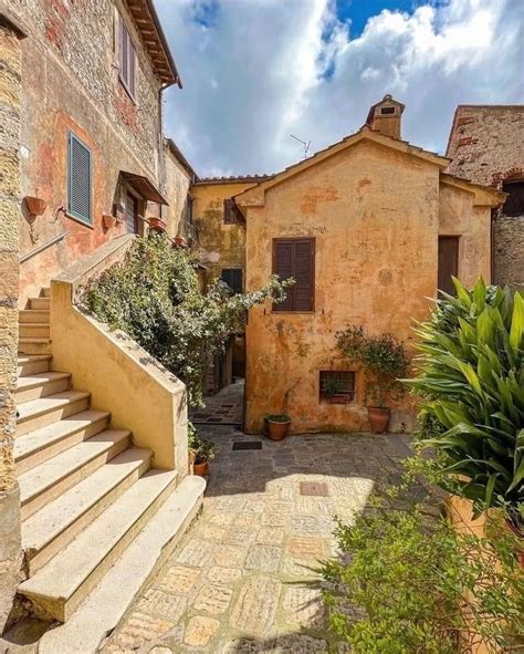 An Old Stone Building With Steps Leading Up To The Front Door And