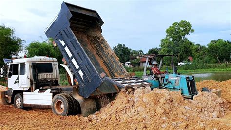 Hyundai Dump Truck Dump Truck Unloading Dirt Bulldozer Pushing Soil