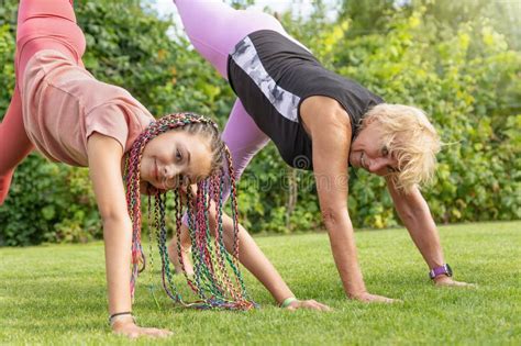 Girl And Mature Woman Are Practicing Gymnastic Elements Together Stock Image Image Of Playing
