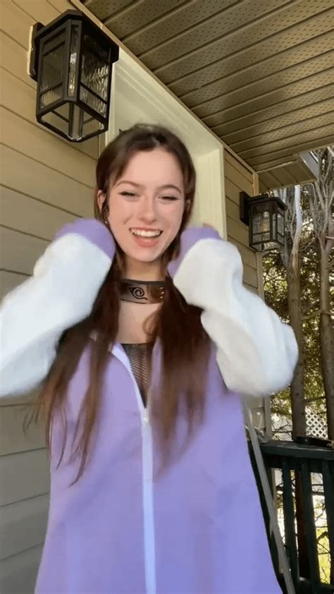 Tiktok User Ccabots Squeezing Her Clothed Boobs Together With Her Arms Showing Her Cleavage