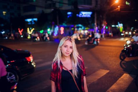 Premium Photo Beautiful Blonde Girl On Background Night Road In Asia