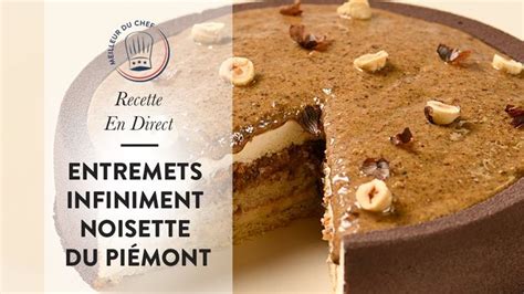 A Chocolate Cake With Nuts On Top And The Words Entrets Infiniment