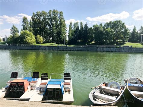 Boats And Catamarans On A Pond Lake In A River Canal With Green