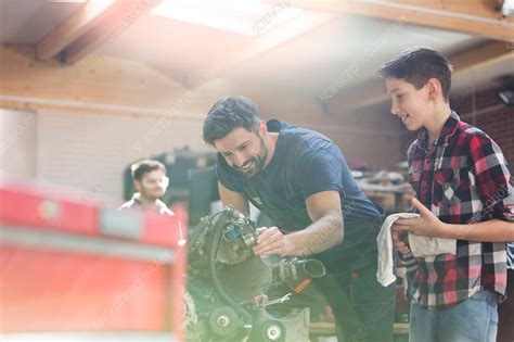 Father And Son Rebuilding Car Engine Stock Image F016 5737