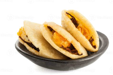 Arepa de huevo. Traditional Colombian fried arepa filled with egg and ...