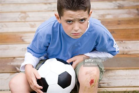 Boy With Grazed Knee High Res Stock Photo Getty Images