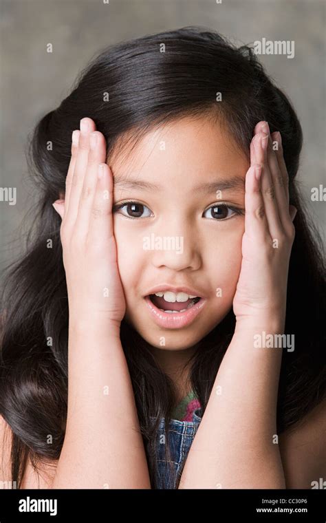 Portrait Of Surprised Girl 8 9 Studio Shot Stock Photo Alamy