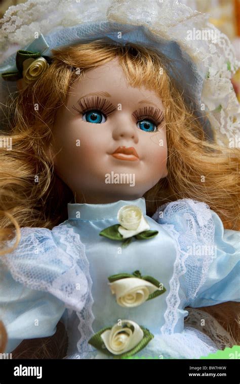Porcelain Doll With Blonde Hair And Blue Eyes Stock Photo Alamy