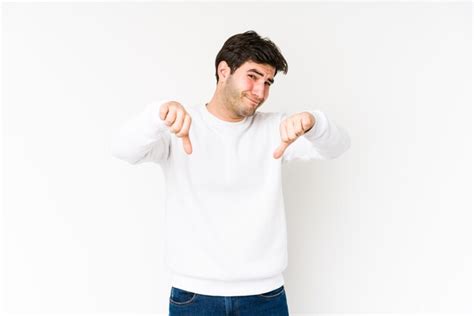 Premium Photo Young Man Isolated On White Showing Thumb Down