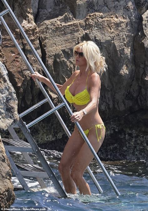 Victoria Silvstedt Shows Off Her Tanned And Toned Physique In A Frilly Yellow Bikini Daily