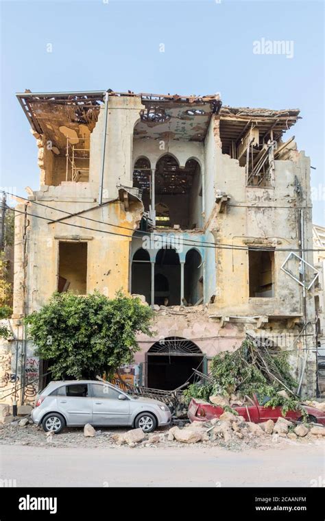 Old traditional building with collapsed facade after a massive