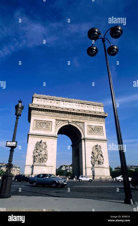 Traffic driving around the Arc de Triomphe roundabout, Paris, France ...