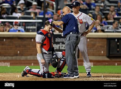 Atlanta Braves Catcher Sean Murphy Is Attended To By Team Trainer