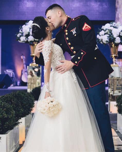 A Bride And Groom Kissing At Their Wedding