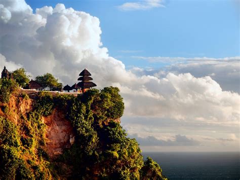 An Island With Some Huts On Top Of It