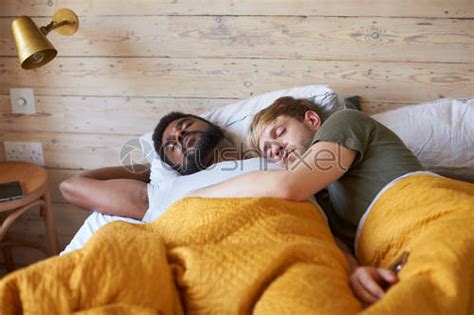 Gay Couple Sleeping Together Hugging In Bed Stock Photo Crushpixel