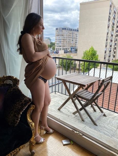 Pregnant Smoker Leila Teasing Nude With Her Bulging Tummy Her Dark Nipples CoedCherry